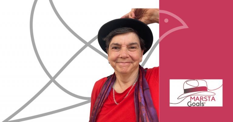 A rectangular graphic featuring Heather Barrie. On the left, Heather stands smiling, wearing a red top, a purple scarf and a black hat which she is holding with one hand. Behind her is a large grey outline of the Lark bird logo on a white background. On the right side of the image is a solid raspberry pink panel with part of the Lark bird outline in a lighter shade. At the bottom right is the MARSTA Goals logo, which shows a stylised hat with a red band and the words “MARSTA Goals”.